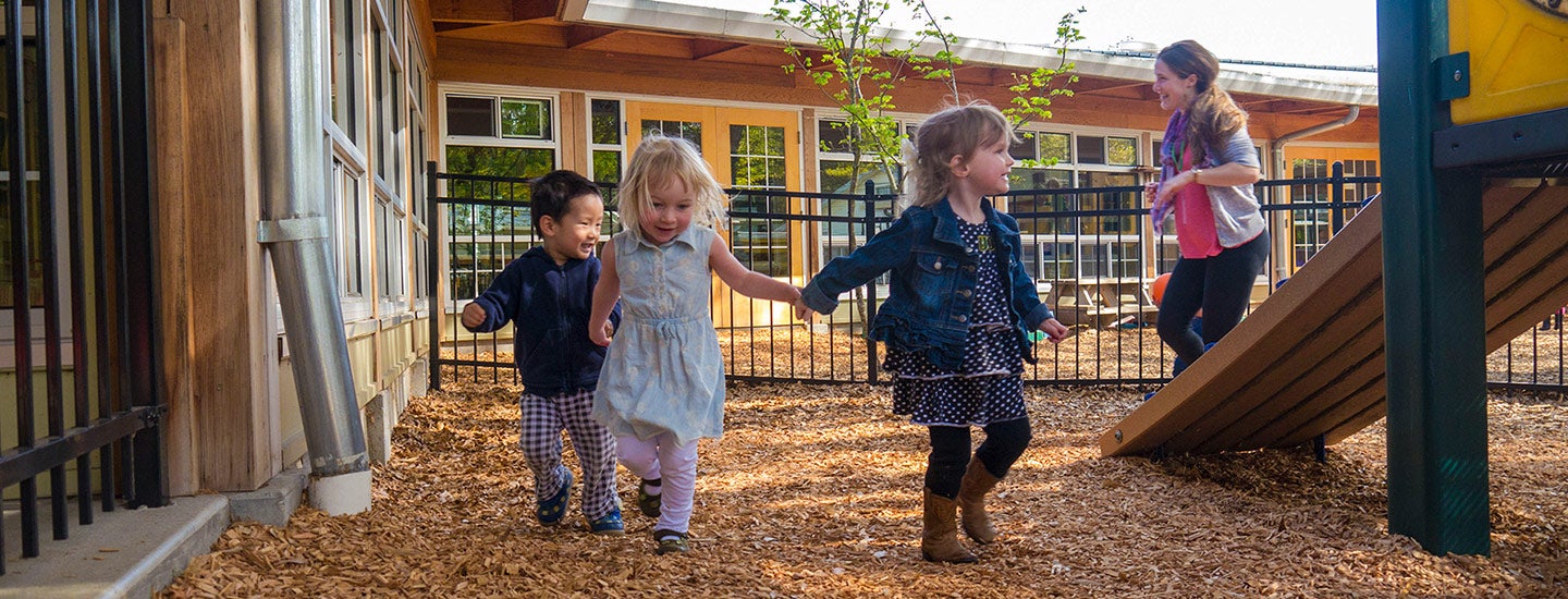 Supervised children playing at Moss Street Children’s Center playground.